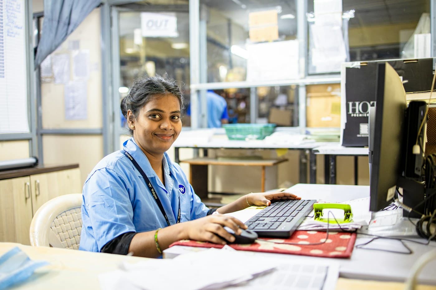 A hospital staff member working at a computer
